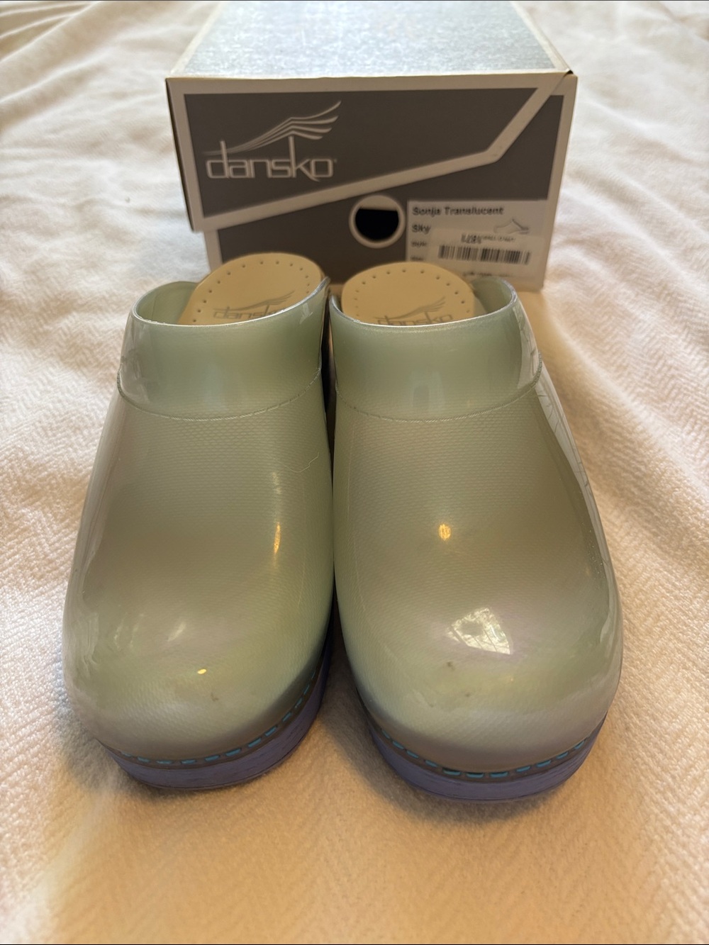 Dansko Sky Translucent Clogs in irredescent sky with lavendar soles